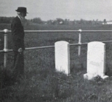  Moses Kreider looking at the tombstones of his grandparents: Jacob Kreider and Elizabeth Schaeffer Kreider. Genealogy of John S. and Rebecca Kettering Kreider Family.